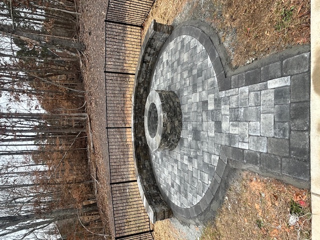 Outdoor firepit and patio at dusk
